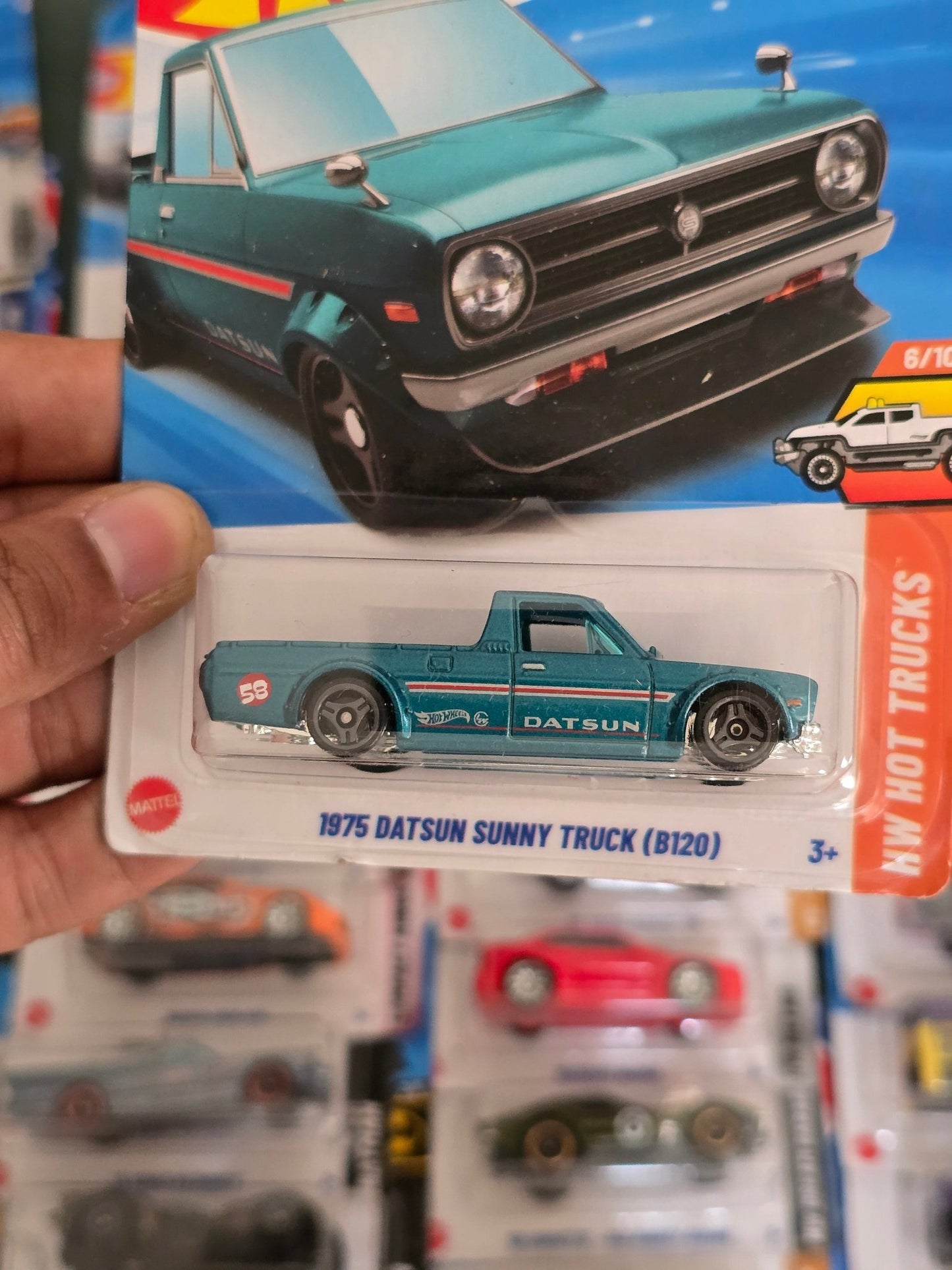 Hot Wheels 1975 Datsun Sunny Truck B120 (Imported) - Kinder Logs
