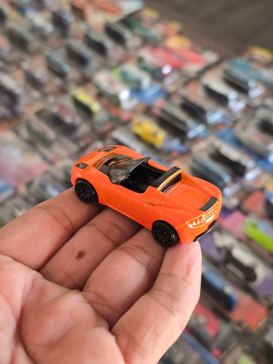 Hot Wheels Tesla Roadster - Orange (Uncarded) - Kinder Logs