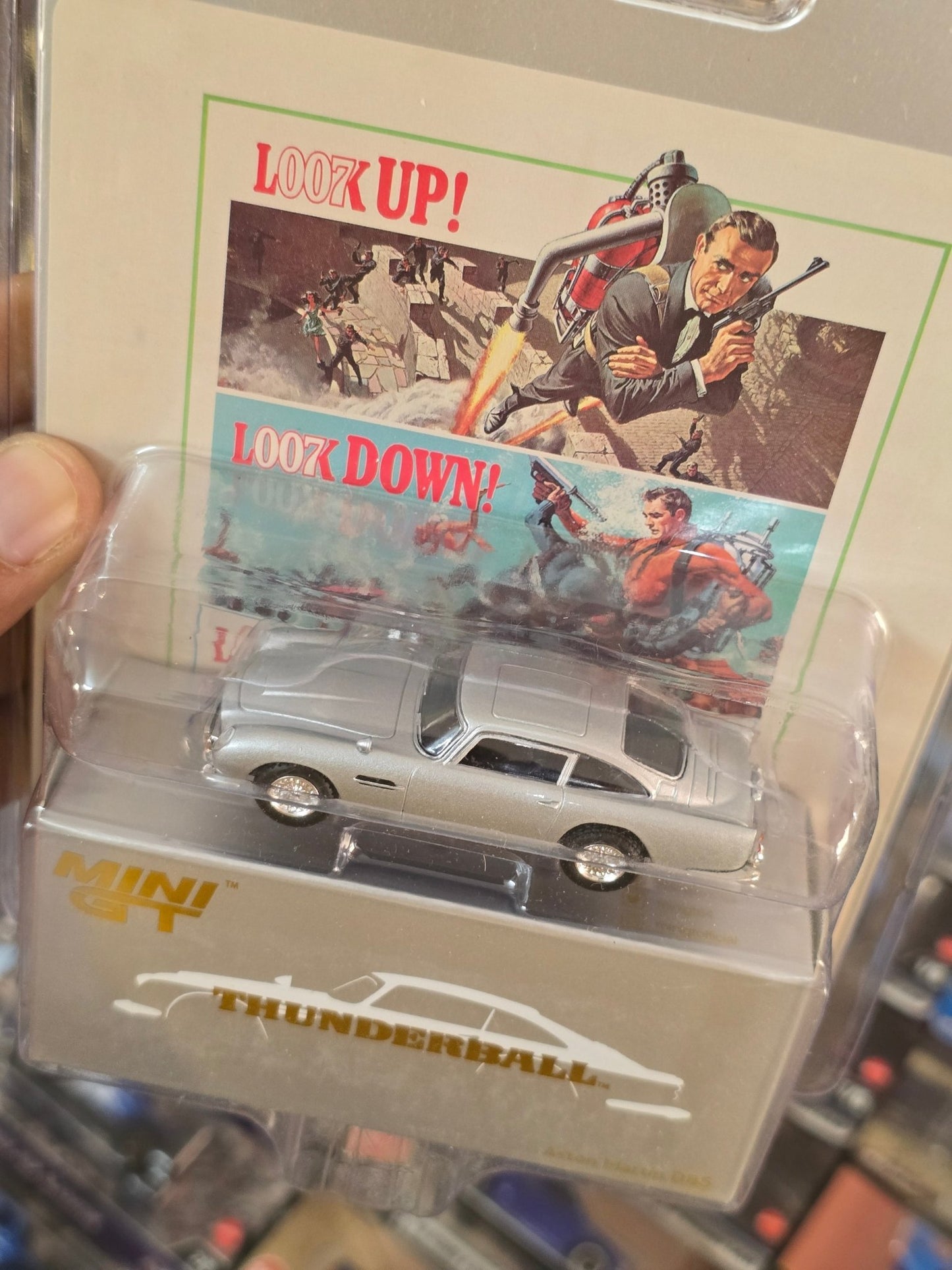 Mini GT Aston Martin DB5 “Thunderball” - Blister Pack - Kinder Logs