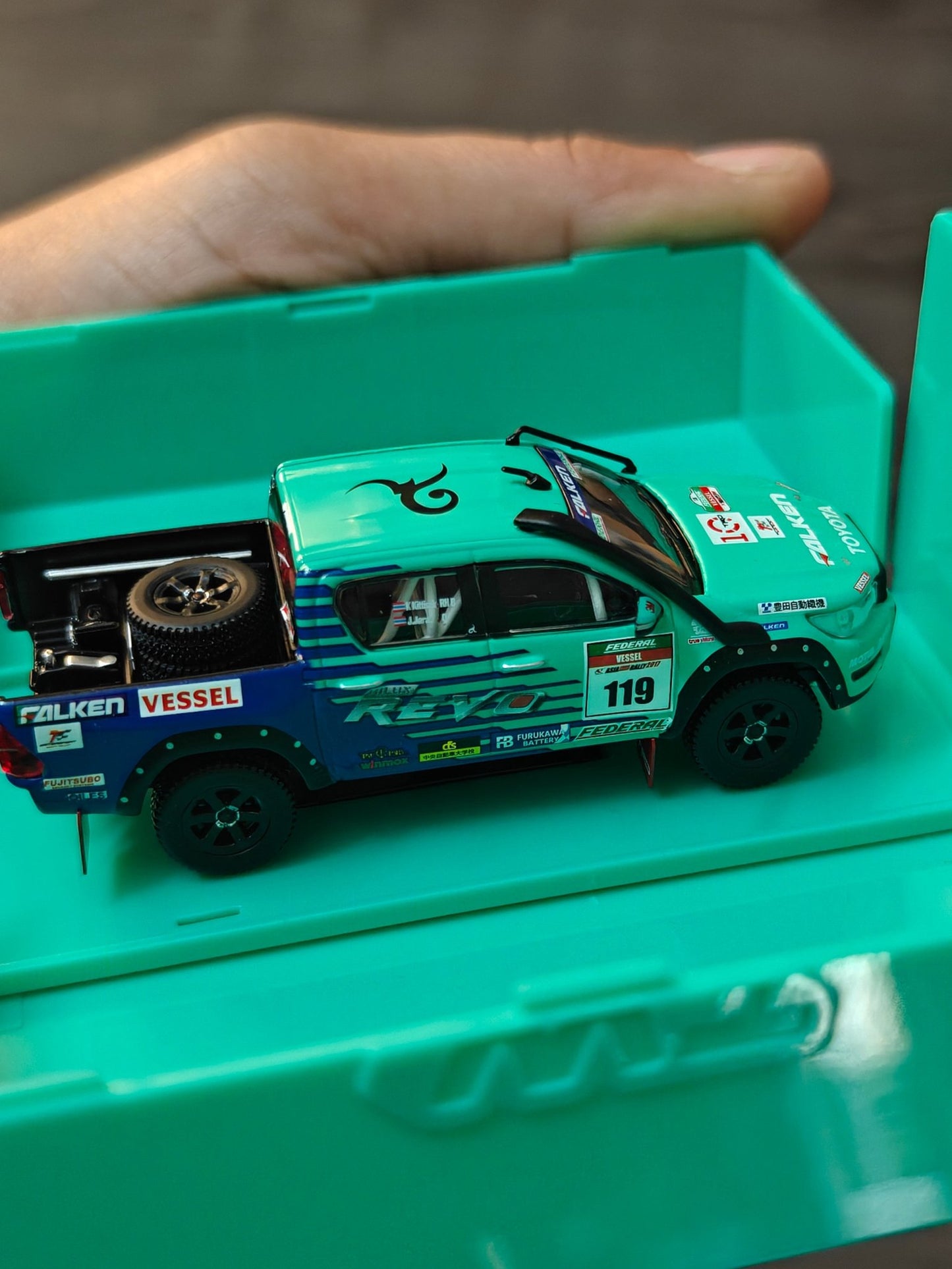 Tarmac Works Toyota Hilux AXCR 2017 with Truck (Open Box) - Kinder Logs