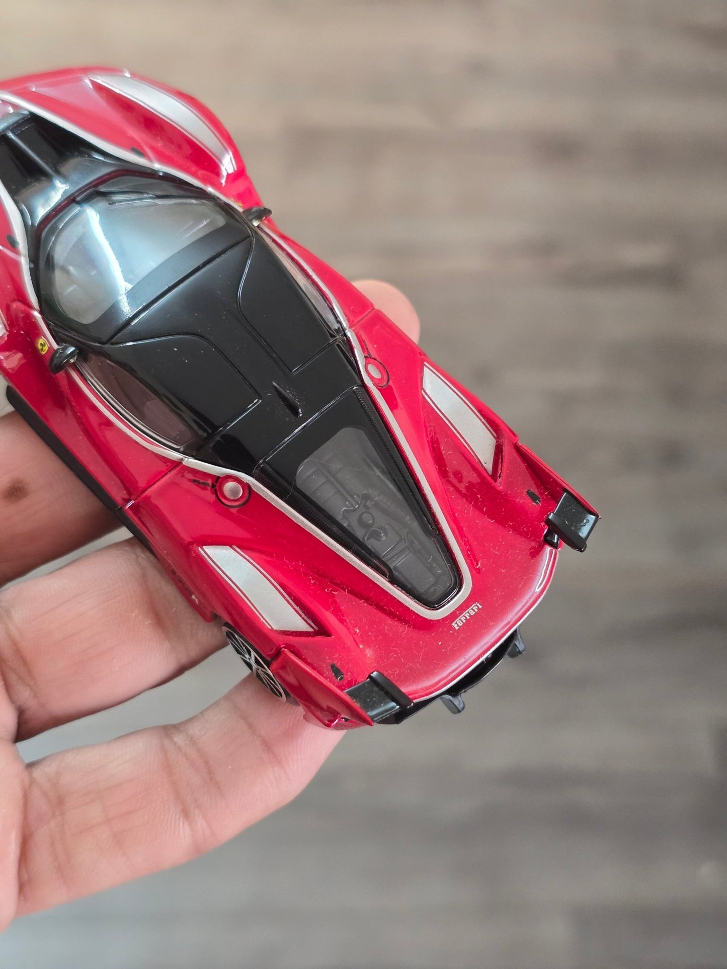 1:43 Bburago Ferrari FXX K Number 10 - Red (Uncarded - New) - Kinder Logs