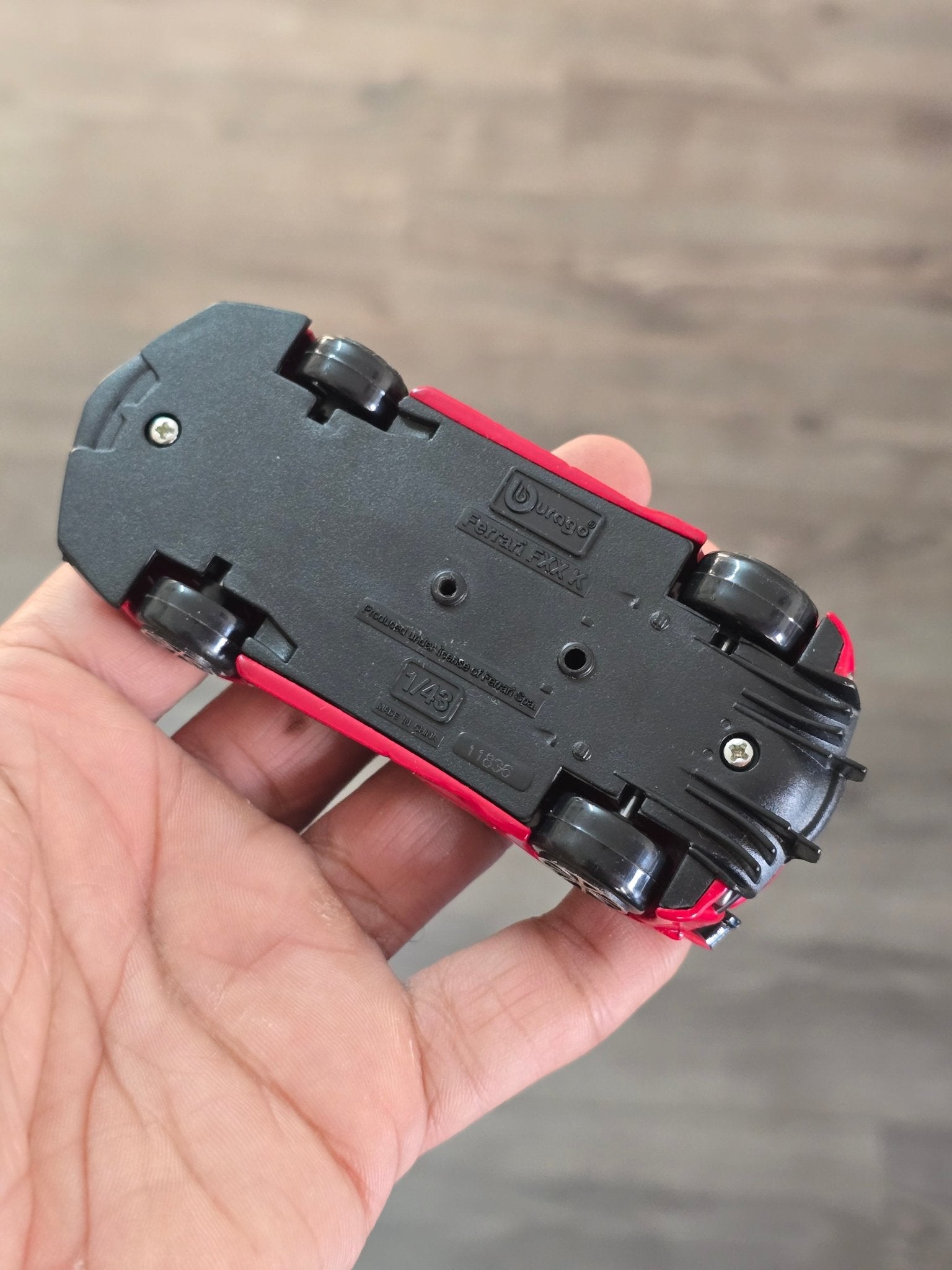 1:43 Bburago Ferrari FXX K Number 10 - Red (Uncarded - New) - Kinder Logs