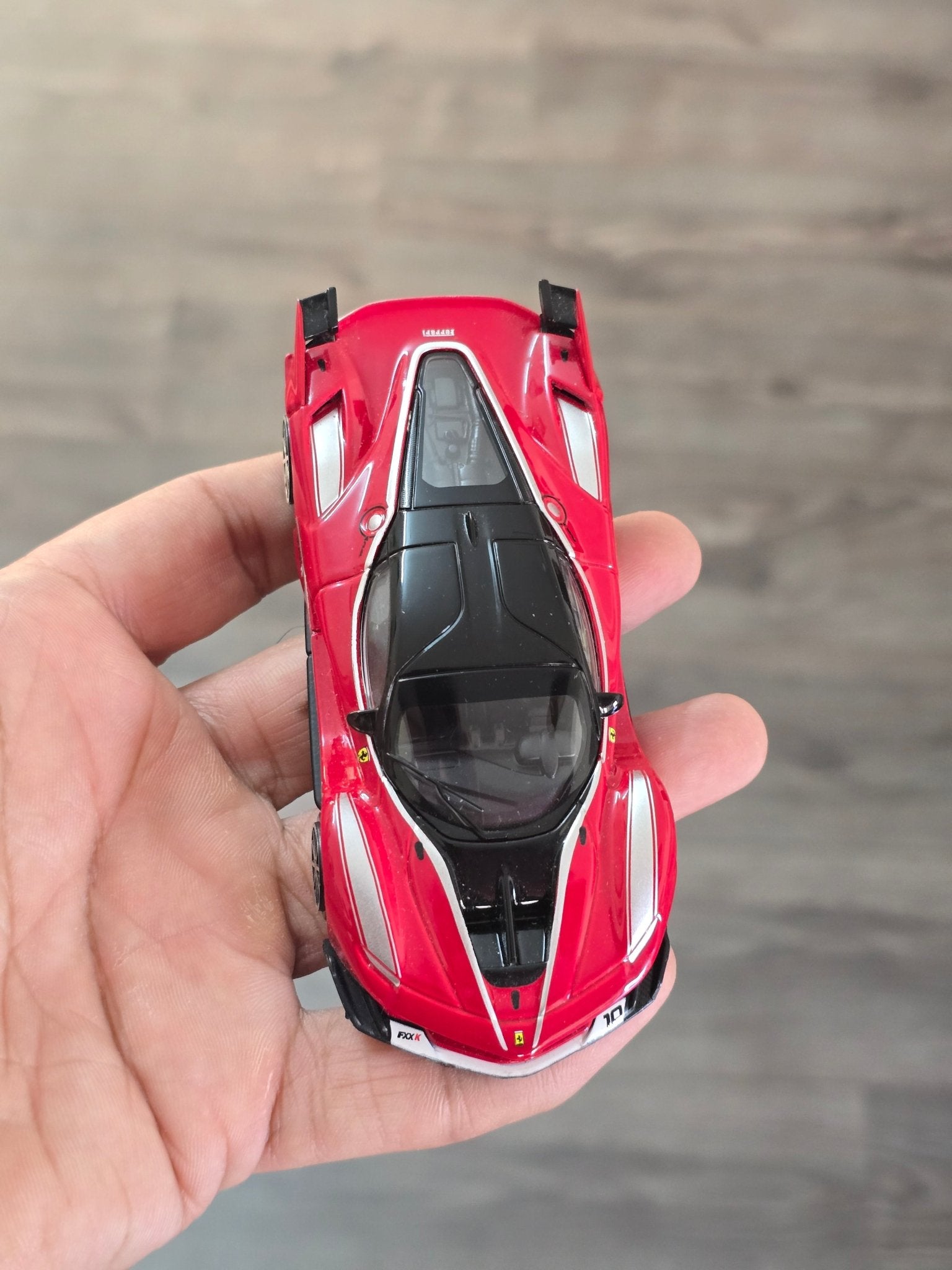 1:43 Bburago Ferrari FXX K Number 10 - Red (Uncarded - New) - Kinder Logs
