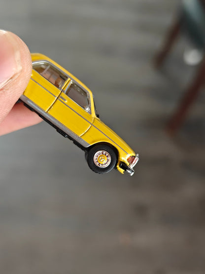 1:87 Schuco Mercedes - Benz W123 Sedan - Yellow (Uncarded) - Kinder Logs