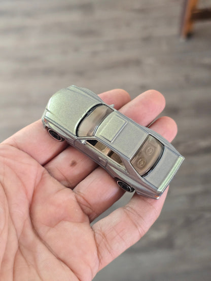 Hot Wheels 1989 Mercedes - Benz 560 SEC AMG - Glitter Gold (Uncarded - New) - Kinder Logs