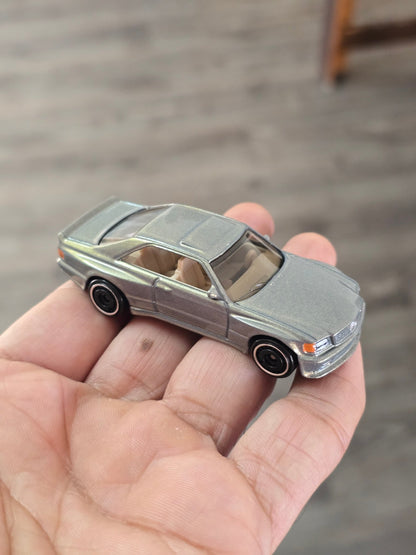 Hot Wheels 1989 Mercedes - Benz 560 SEC AMG - Glitter Gold (Uncarded - New) - Kinder Logs