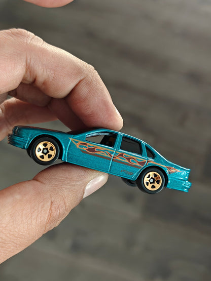 Hot Wheels 1996 Chevrolet Impala SS - Teal (Uncarded - New) - Kinder Logs