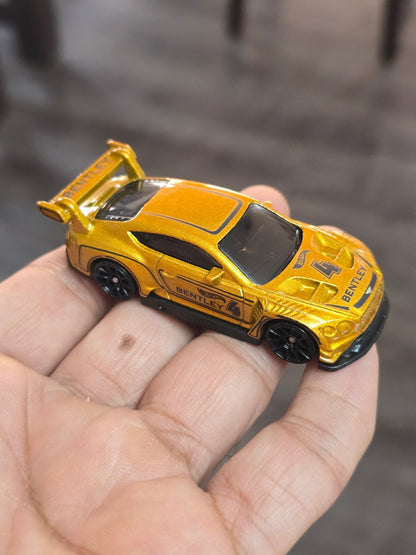Hot Wheels 2018 Bentley Continental GT3 - Gold (Uncarded - New) - Kinder Logs