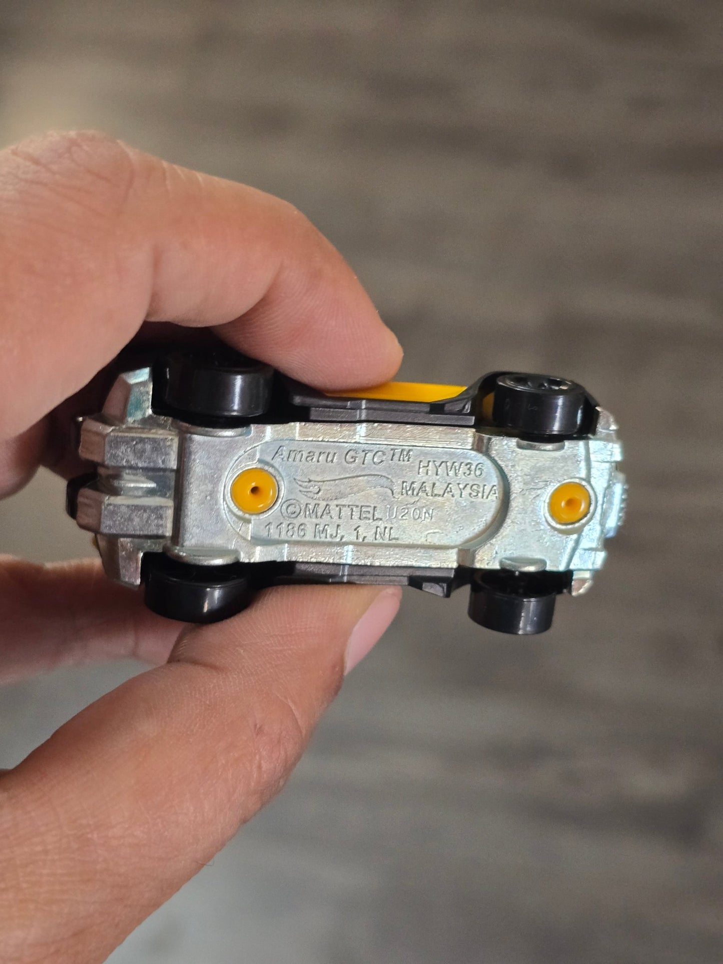 Hot Wheels Amaru GTC - Yellow - With Metal Base (Uncarded - New) - Kinder Logs