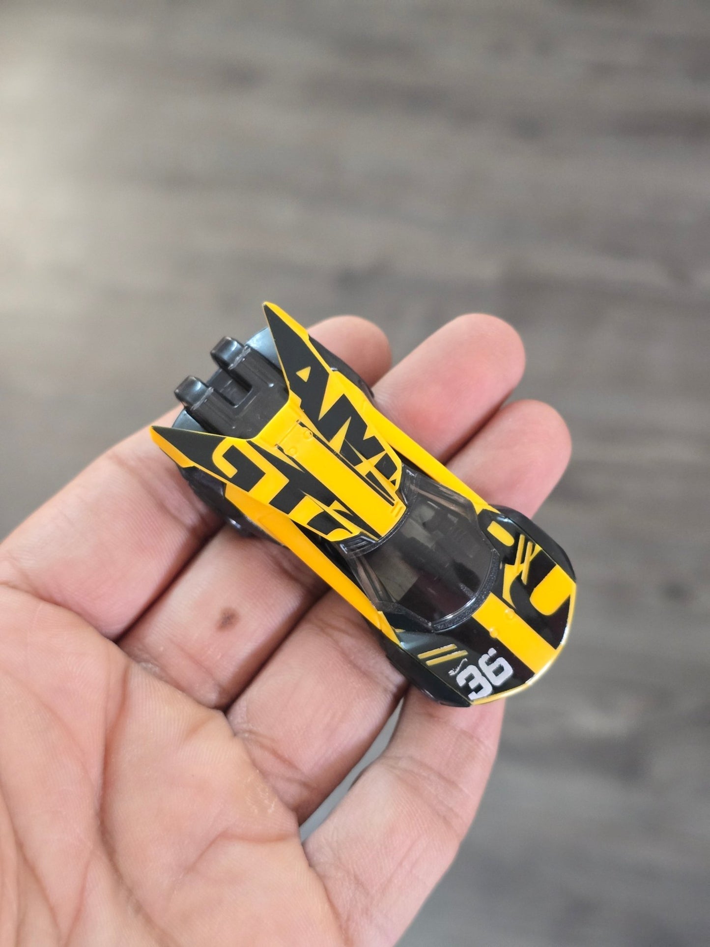 Hot Wheels Amaru GTC - Yellow - With Metal Base (Uncarded - New) - Kinder Logs