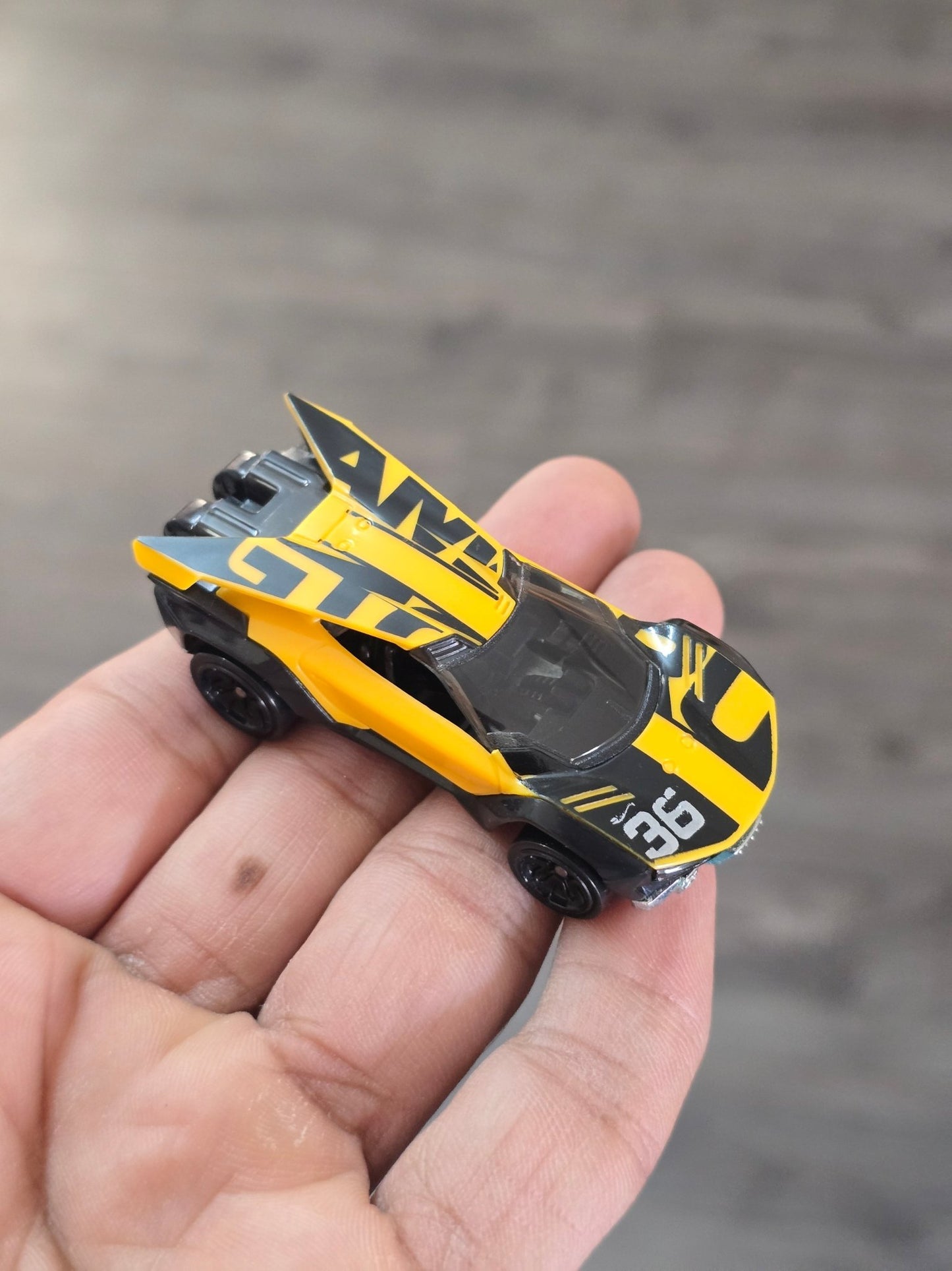 Hot Wheels Amaru GTC - Yellow - With Metal Base (Uncarded - New) - Kinder Logs