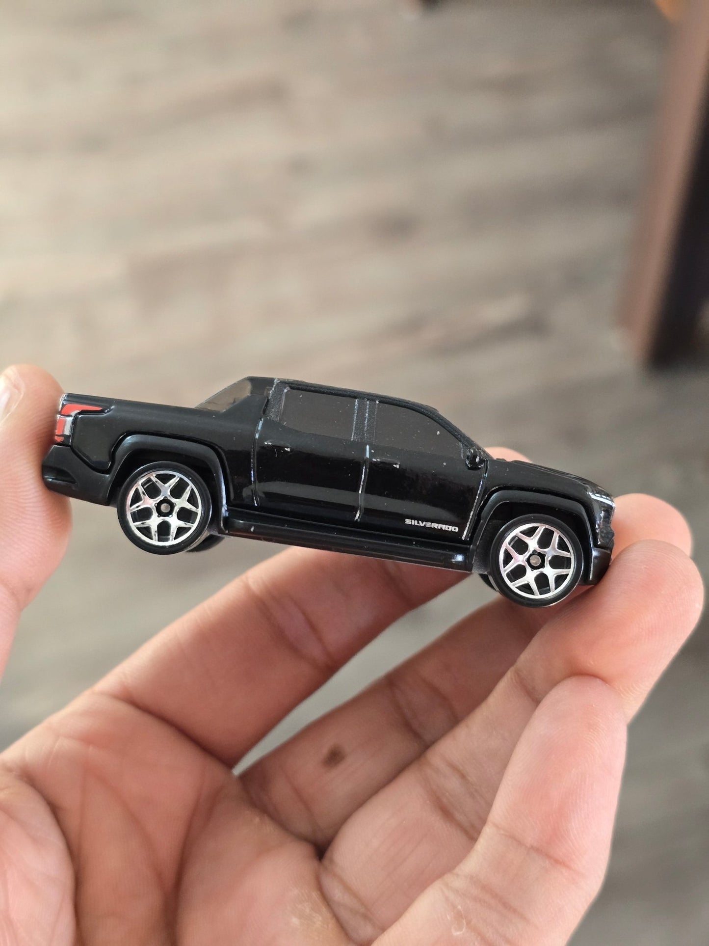 Hot Wheels Chevrolet Silverado EV RST - Black (Uncarded - New) - Kinder Logs