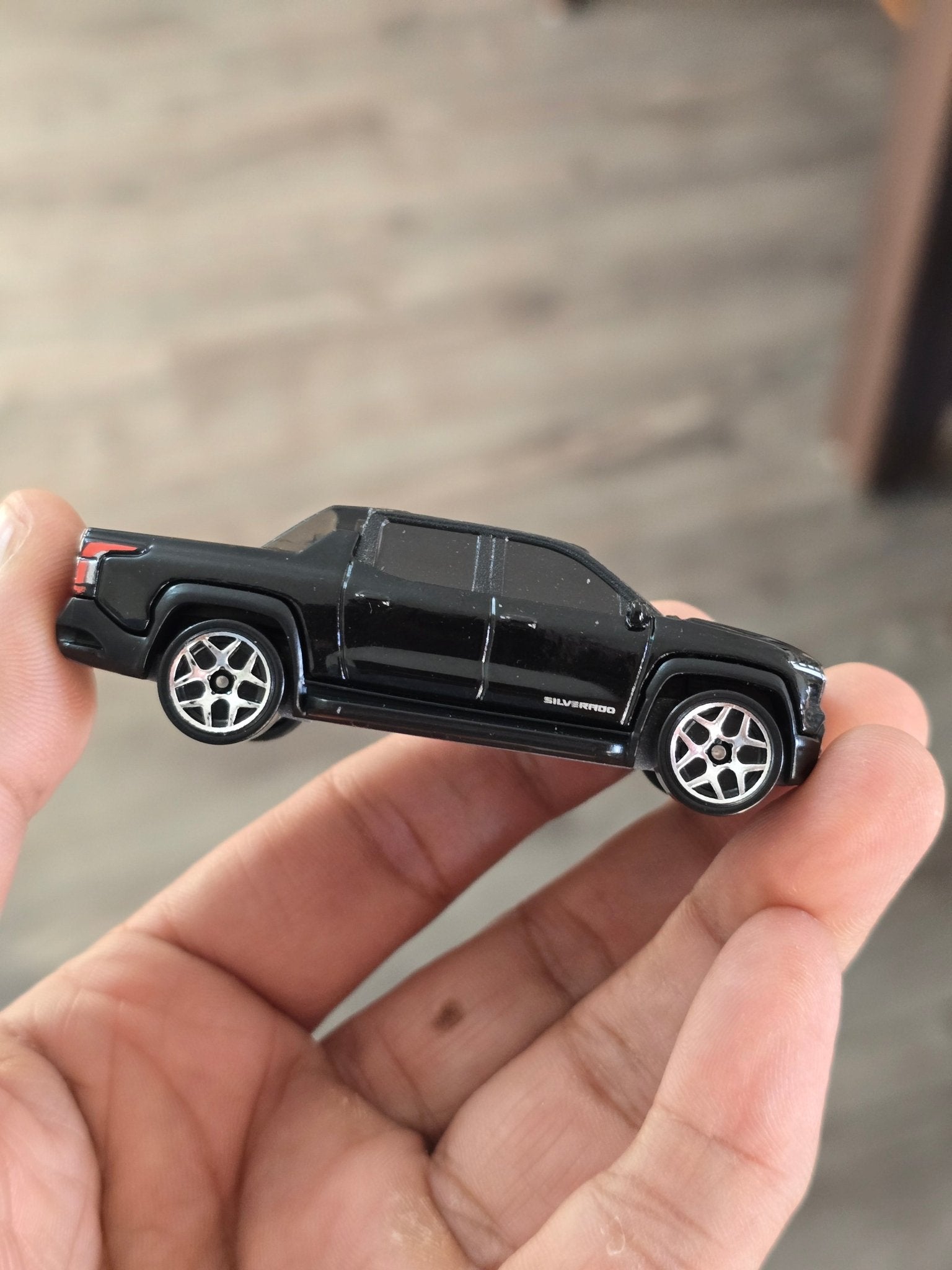 Hot Wheels Chevrolet Silverado EV RST - Black (Uncarded - New) - Kinder Logs