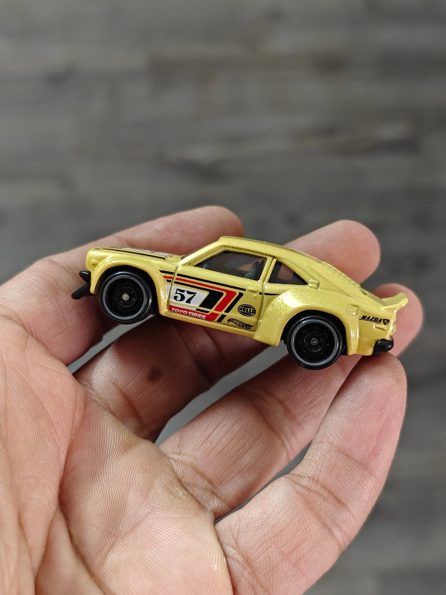Hot Wheels Mazda RX - 3 - Yellow (Uncarded - New) - Kinder Logs