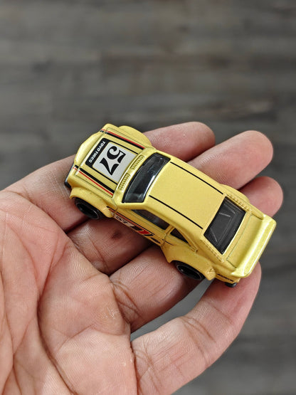 Hot Wheels Mazda RX - 3 - Yellow (Uncarded - New) - Kinder Logs