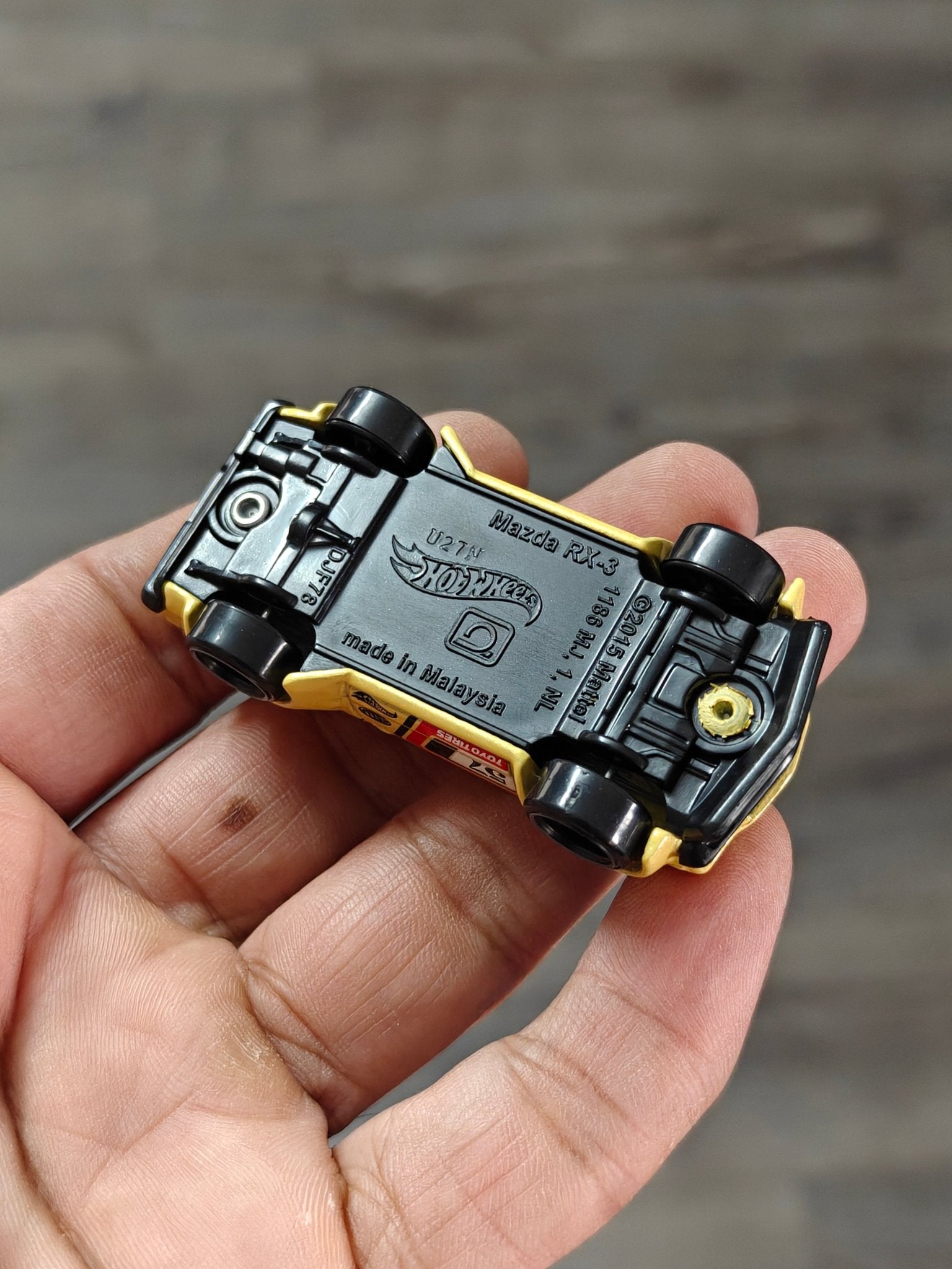 Hot Wheels Mazda RX - 3 - Yellow (Uncarded - New) - Kinder Logs