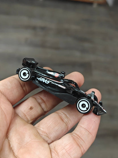Hot Wheels MoneyGram HAAS F1 Team Car (Uncarded - New) - Kinder Logs