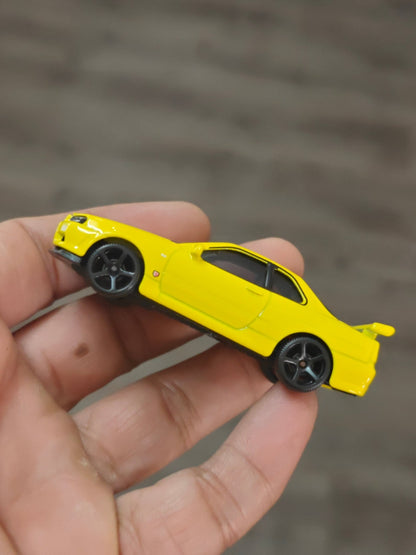 Majorette JDM Nissan Skyline GT - R (R34) - Yellow (Uncarded - New) - Kinder Logs