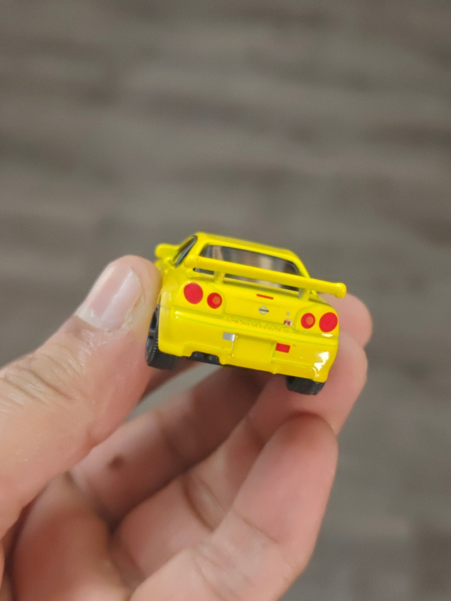 Majorette JDM Nissan Skyline GT - R (R34) - Yellow (Uncarded - New) - Kinder Logs