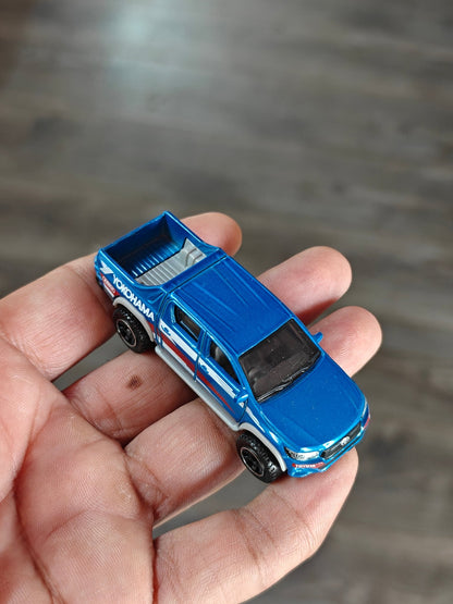 Matchbox 2018 Toyota Hilux YOKOHAMA Edition (Uncarded - New) - Kinder Logs