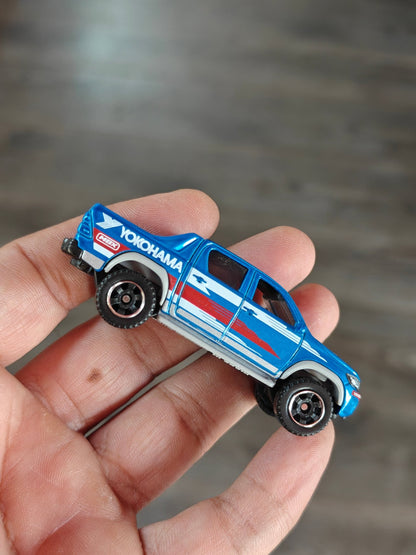 Matchbox 2018 Toyota Hilux YOKOHAMA Edition (Uncarded - New) - Kinder Logs
