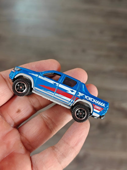 Matchbox 2018 Toyota Hilux YOKOHAMA Edition (Uncarded - New) - Kinder Logs