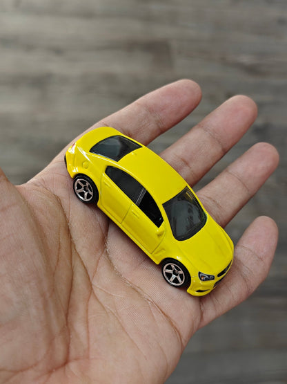 Matchbox Holden VF Commodore SSV - Yellow (Uncarded - New) - Kinder Logs