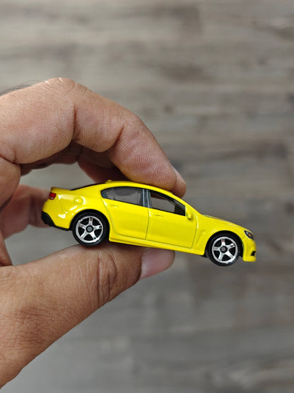 Matchbox Holden VF Commodore SSV - Yellow (Uncarded - New) - Kinder Logs
