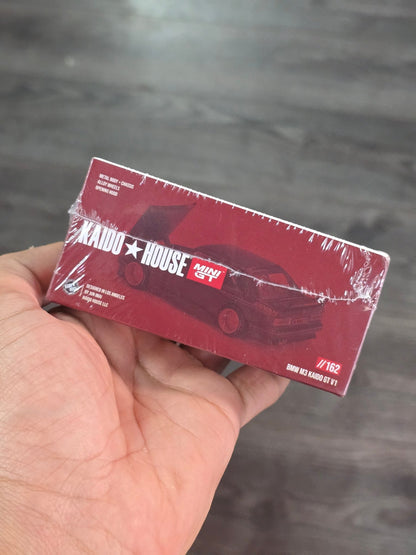 Mini GT 162 Kaido House BMW M3 Kaido GT V1 Advan (Sealed Pack) - Kinder Logs