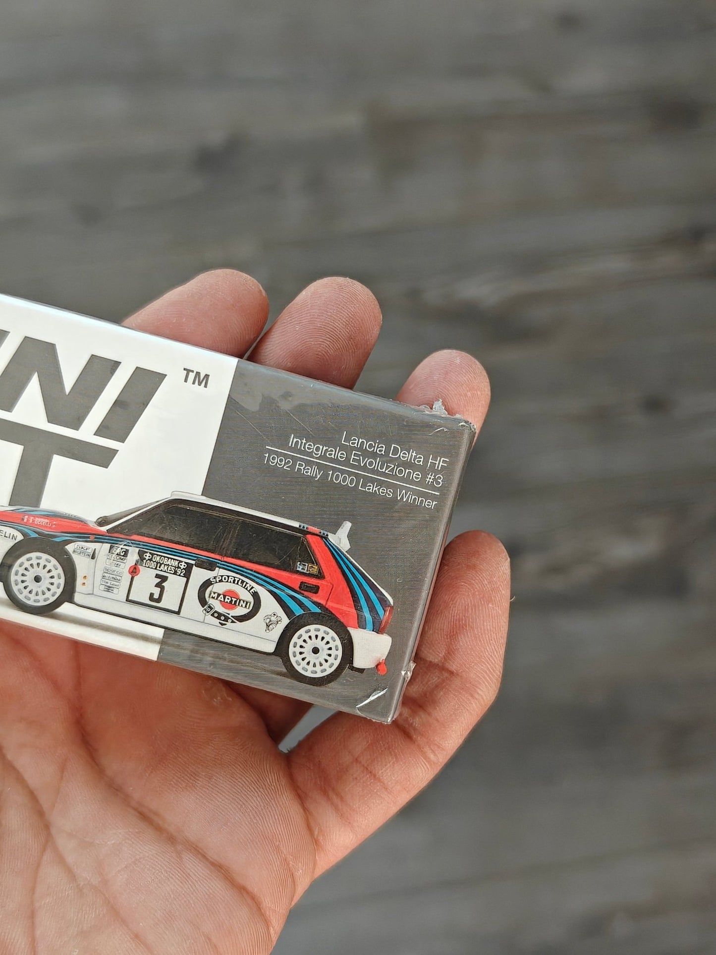Mini GT Lancia Delta HF Integrale Evoluzione - 1992 Rally 1000 Lakes Winner 3 (Sealed Box) - Kinder Logs