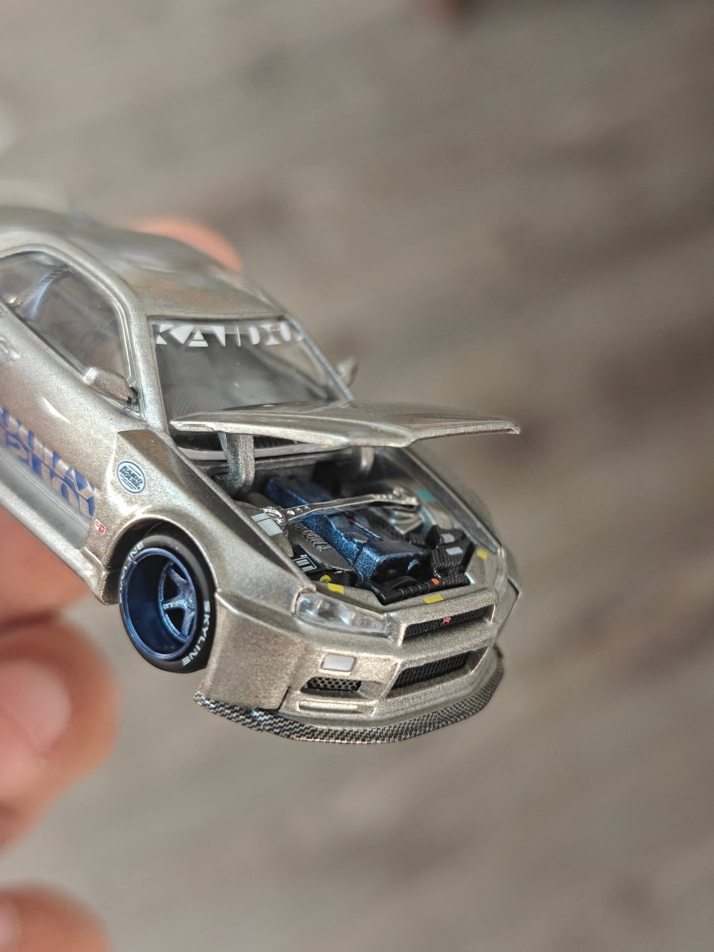 Mini GT Nissan Skyline GT - R (R34) Kaido Works Shinjuku V1 (Open Box) - Kinder Logs