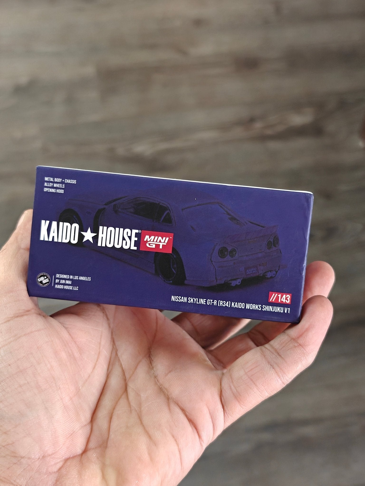 Mini GT Nissan Skyline GT - R (R34) Kaido Works Shinjuku V1 (Open Box) - Kinder Logs