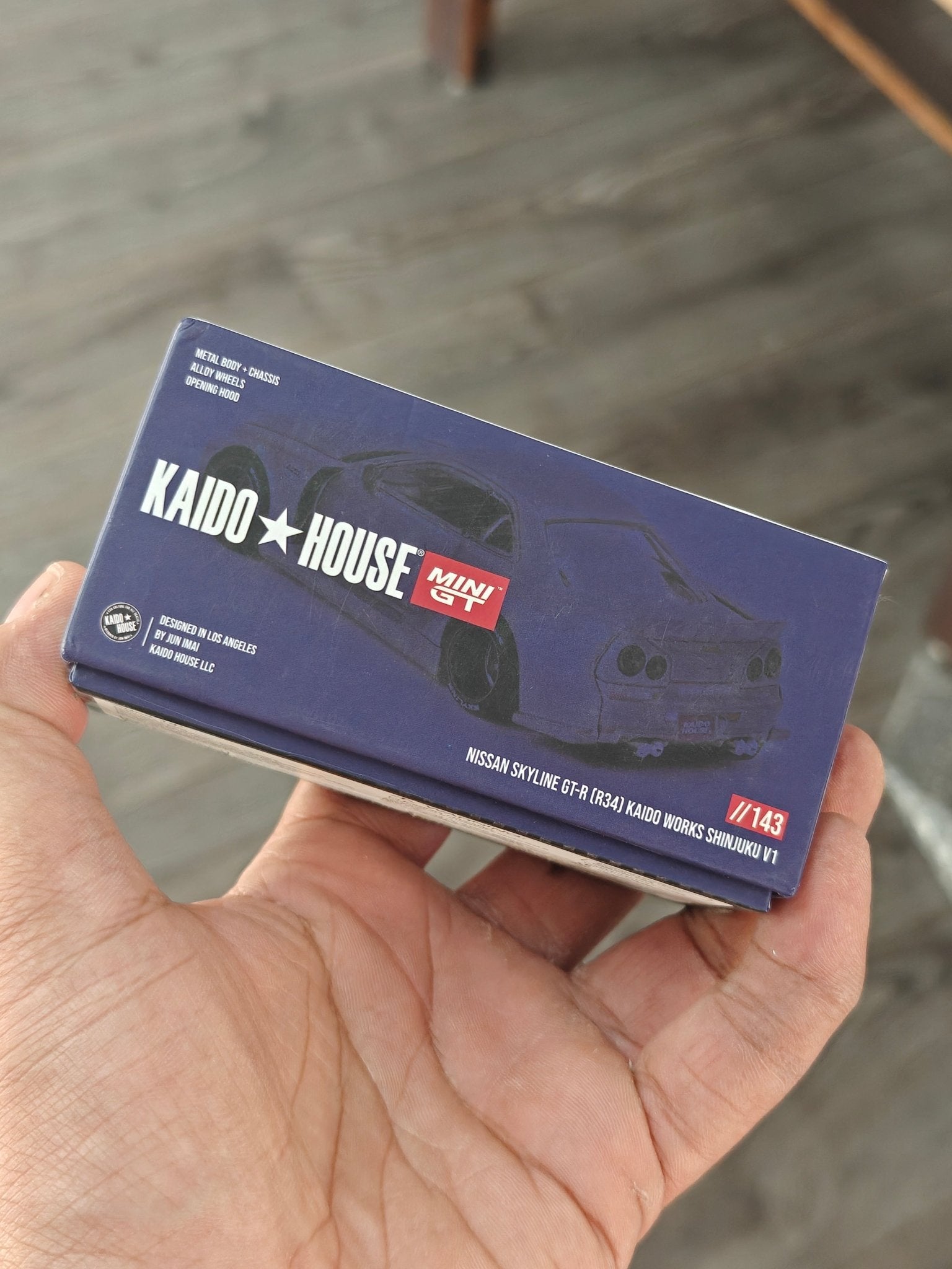 Mini GT Nissan Skyline GT - R (R34) Kaido Works Shinjuku V1 (Open Box) - Kinder Logs