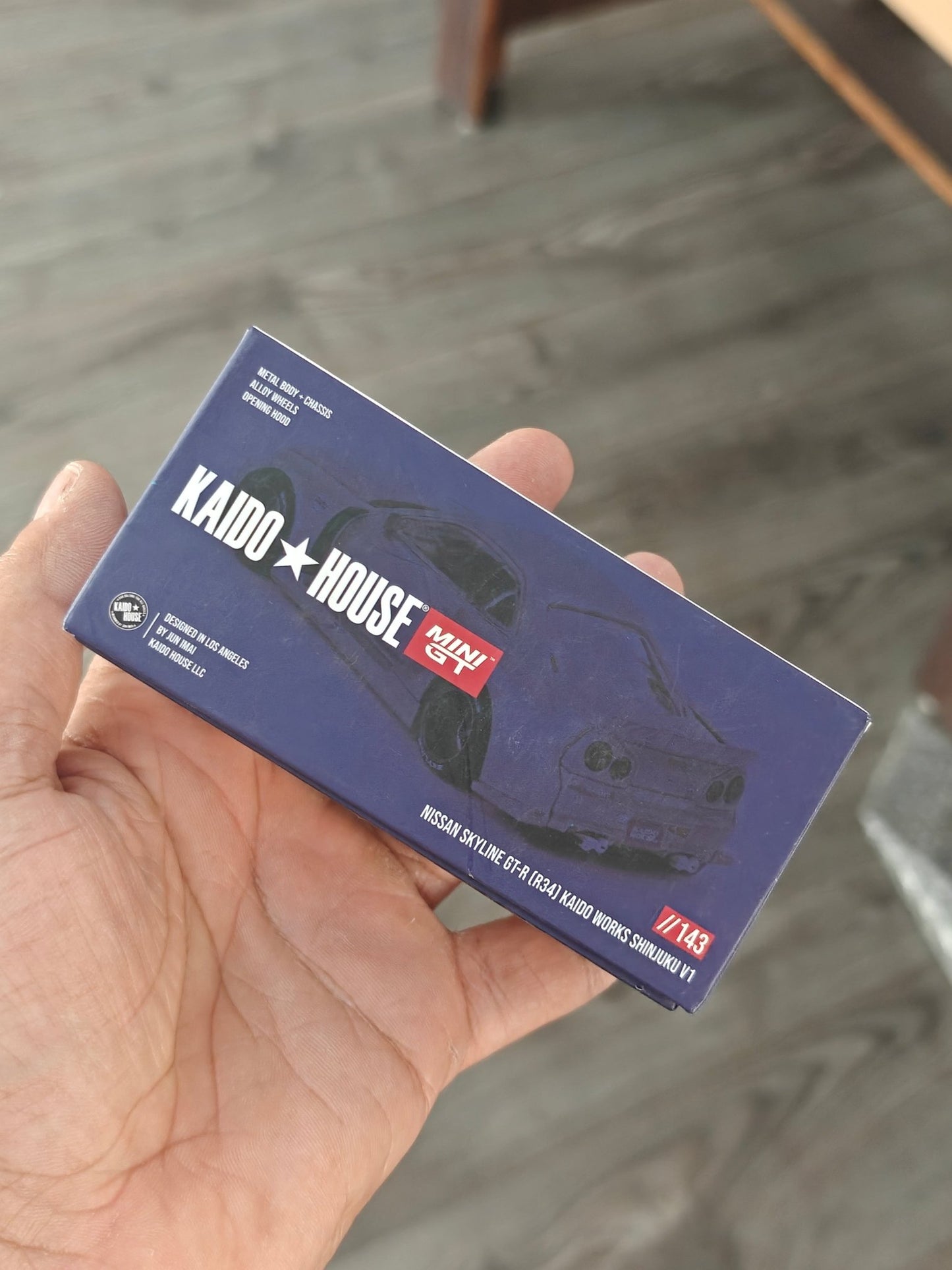 Mini GT Nissan Skyline GT - R (R34) Kaido Works Shinjuku V1 (Open Box) - Kinder Logs