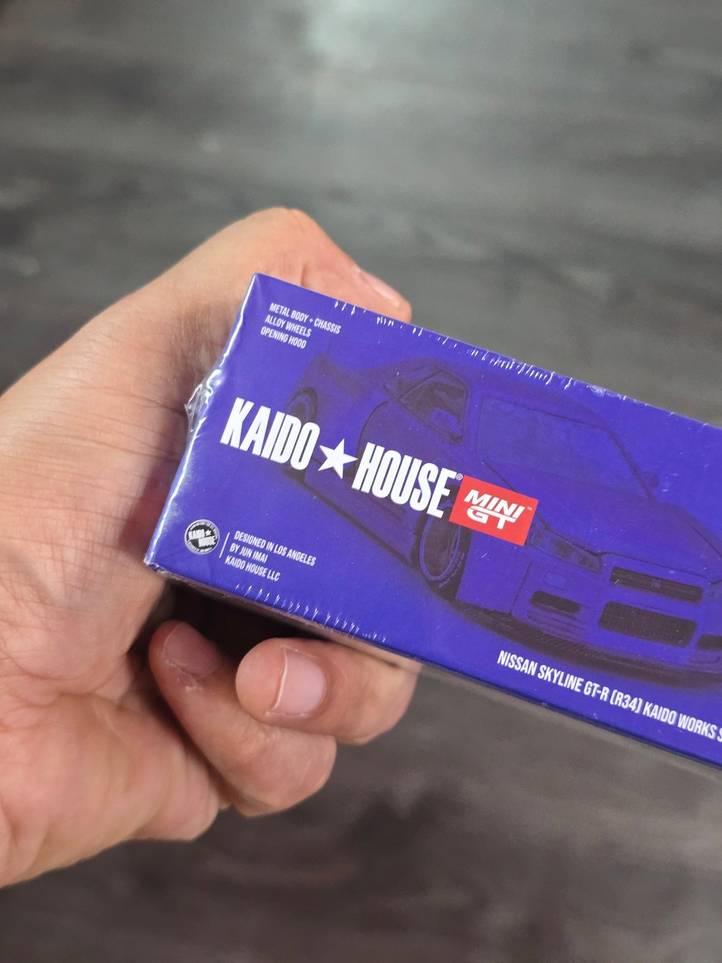 Mini GT Nissan Skyline GT - R (R34) Kaido Works Shinjuku V2 (Blue) - Kinder Logs