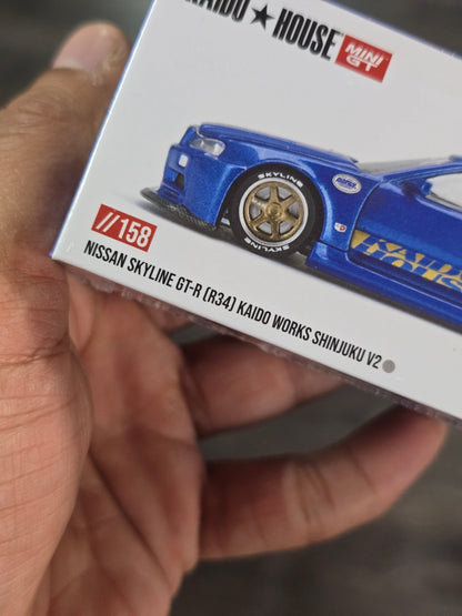 Mini GT Nissan Skyline GT - R (R34) Kaido Works Shinjuku V2 (Blue) - Kinder Logs