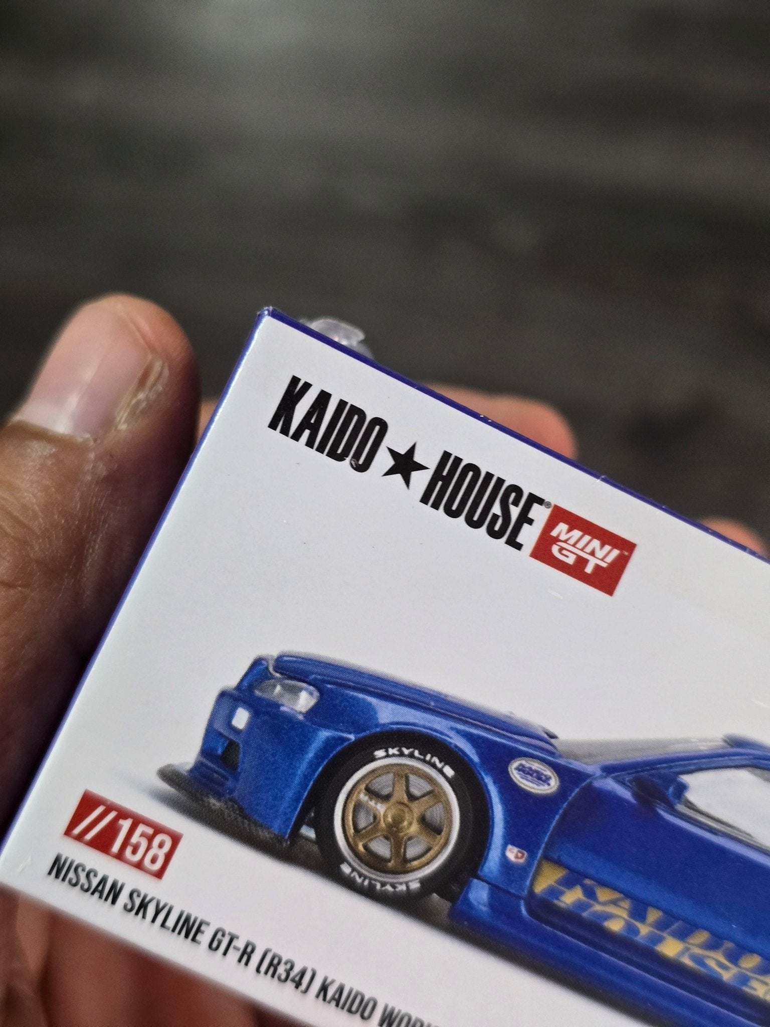 Mini GT Nissan Skyline GT - R (R34) Kaido Works Shinjuku V2 (Blue) - Kinder Logs