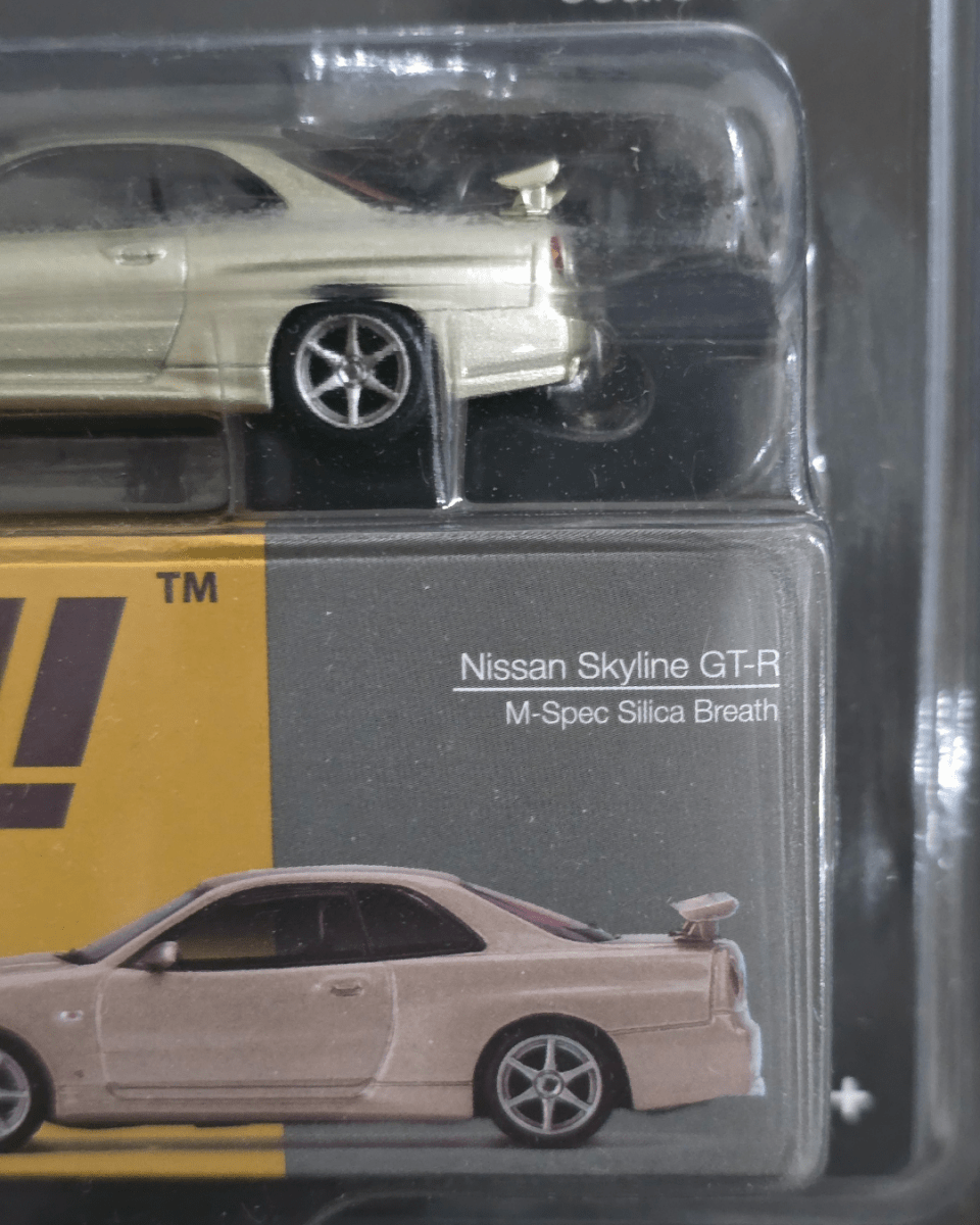Mini GT Nissan Skyline GT - R (R34) M - Spec Silica Breath - Mijo Exclusives - Kinder Logs