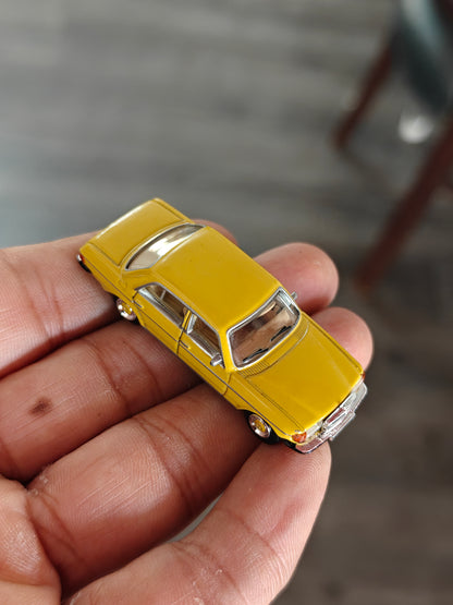 Schuco Mercedes-Benz W123 Sedan - Yellow (Uncarded)