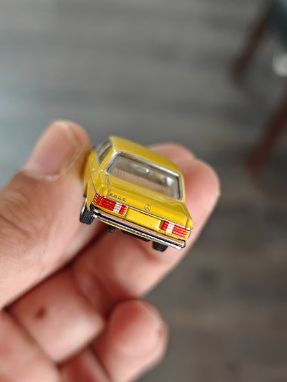 Schuco Mercedes-Benz W123 Sedan - Yellow (Uncarded)