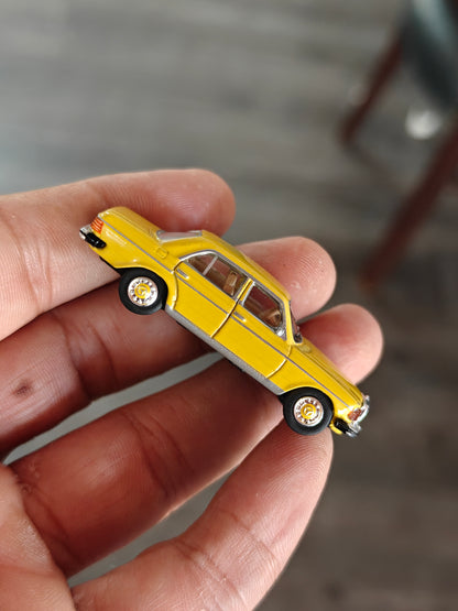 Schuco Mercedes-Benz W123 Sedan - Yellow (Uncarded)